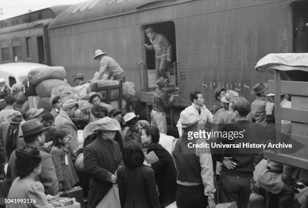 Japanese-Americans Gathering around Baggage Car During Evacuation of Japanese-Americans from West Coast Areas under US Army War Emergency Order, Los...