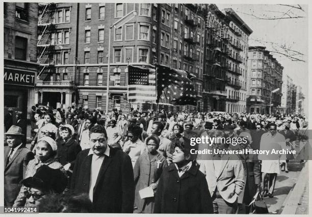 Crowd of Mourners, some Carrying Flags, Marching down 7th Avenue near 112th Street on way to Attend Memorial Service for Dr Martin Luther King Jr in...