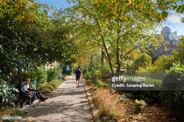 People enjoying The Promenade Plantee or Coulee verte Rene-Dumont, Elevated park in 12th arrondissement, Paris, France.