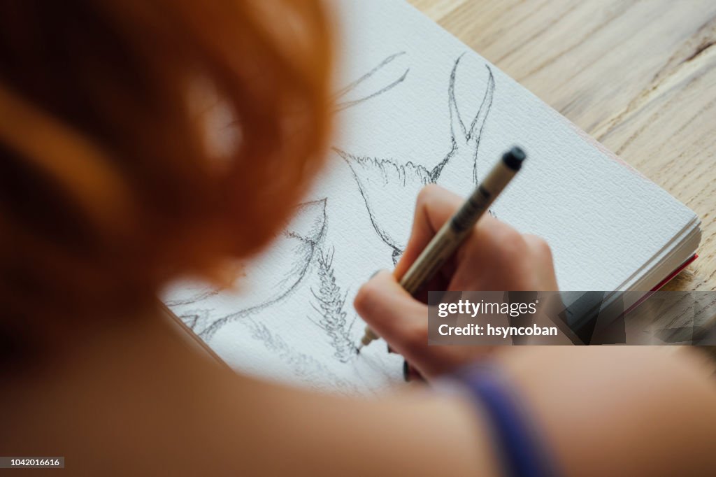 Artist working at coffee shop