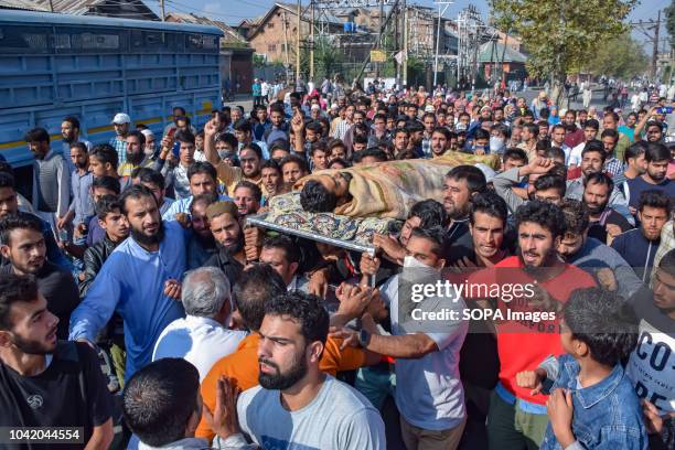 People seen carrying the body of Slain Civilian Mohammed Saleem Malik towards martyrs graveyard during his funeral. Mohammed Saleem Malik a civilian...