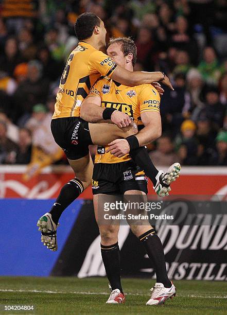 Benji Marshall and Gareth Ellis of the Tigers celebrate a try during the first NRL semi final match between the Canberra Raiders and the Wests Tigers...