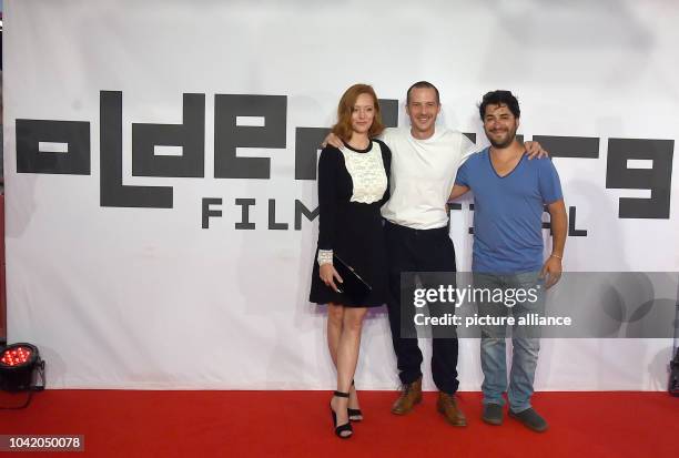 Producer, actress, and director Lavinia Wilson, Barnaby Metschurat and cameraman Andres Lizana Prado arrive on the red carpet during the Filmfest...