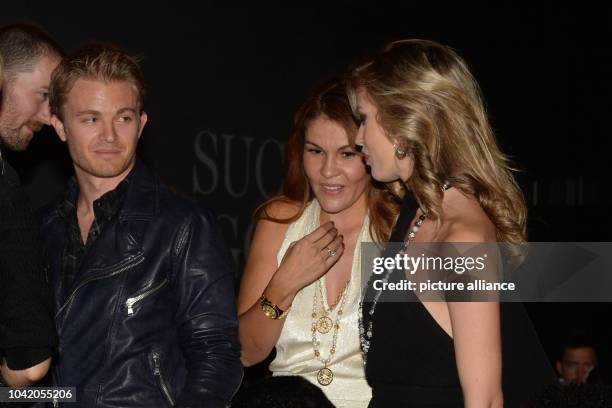 Racing driver Nico Rosberg looks at British model Georgia May Jagger at the Thomas Sabo Karma Night at the Postpalast in Munich, Germany, 15 February...