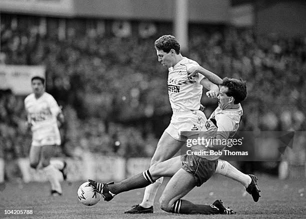 Clive Allen of Tottenham Hotspur is tackled by Steve Simms of Watford during the Tottenham Hotspur v Watford FA Cup Semi-Final match played at Villa...