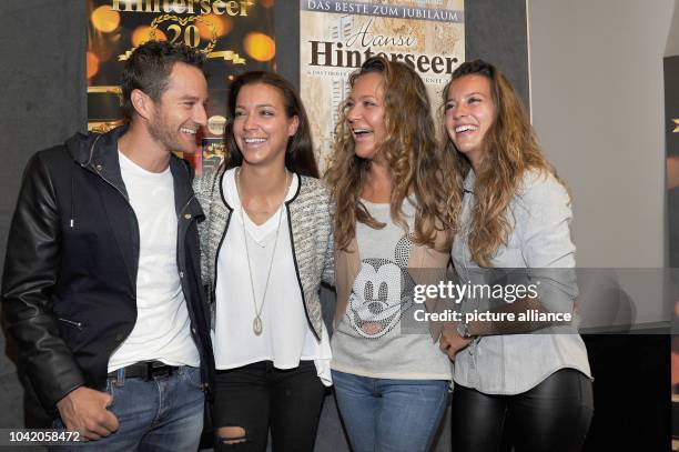 Ramona Hinterseer , her daughters Laura and Jessica with her boyfriend Timo Scheider smile at the Filmtheater in Kitzbuehel, Austria, 20 October...