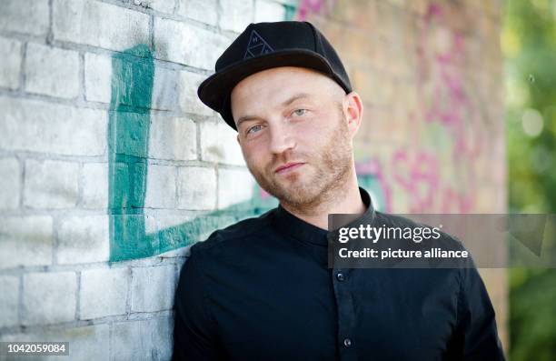 Rapper Chakuza, privately Peter Pangerl, is pictured during an interview in Berlin, Germany, 13 August 2014. Photo: Christoph Schmidt/dpa | usage...