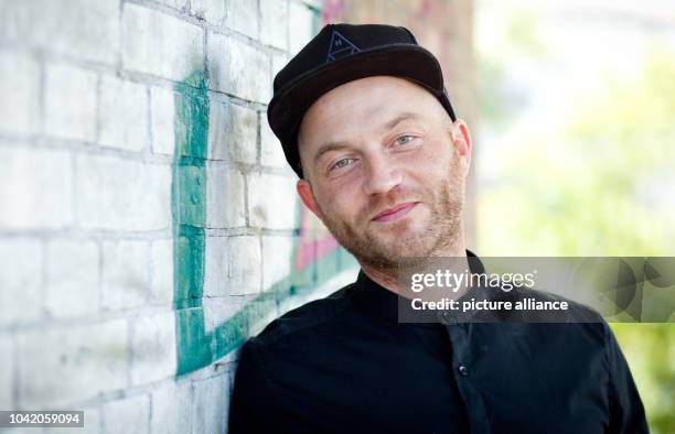 Rapper Chakuza, privately Peter Pangerl, is pictured during an interview in Berlin, Germany, 13 August 2014. Photo: Christoph Schmidt/dpa | usage...