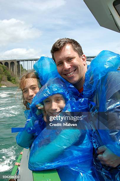 a picture of a father and his daughters on a boat - niagara falls stock pictures, royalty-free photos & images