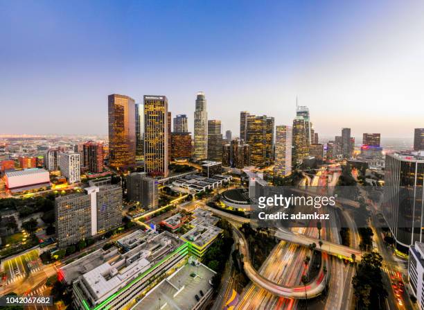 aerial downtown los angeles skyline at night - downtown district stock pictures, royalty-free photos & images