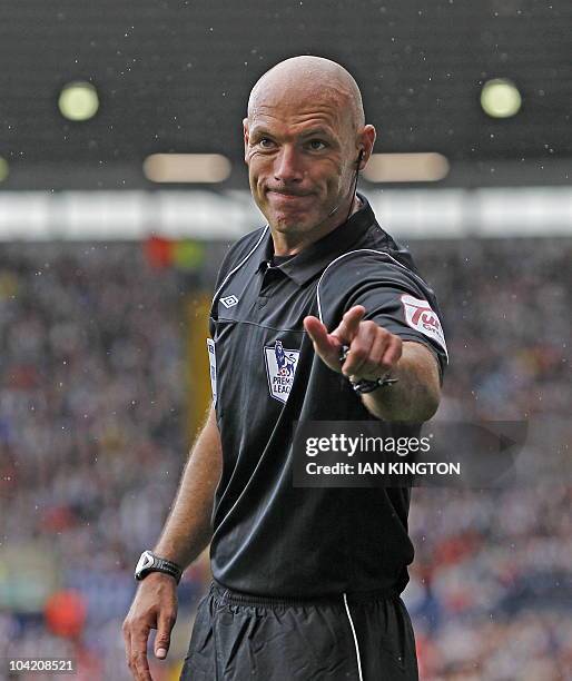 English referee Howard Webb gestures during the English Premier League football match between West Bromwich Albion and Tottenham Hotspur at The...