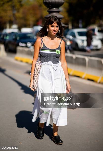 Natasha Goldenberg wearing Prada top, white skirt is seen outside Paco Rabanne during Paris Fashion Week Womenswear Spring/Summer 2019 on September...
