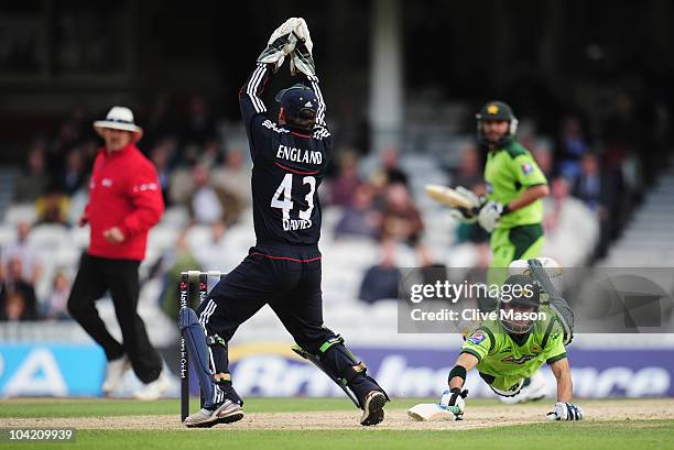 Fawad Alam of Pakistan dives to make his ground as Steven Davies of England takes the ball over the stumps during the 3rd NatWest One Day...