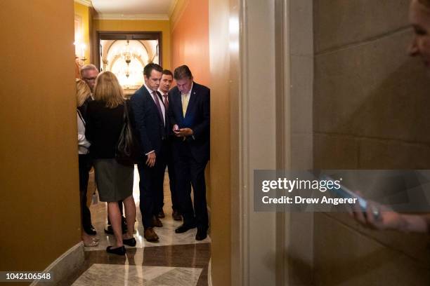 Sen. Joe Manchin exits after meeting privately with Senators Jeff Flake , Susan Collins , and Lisa Murkowski following the Senate Judiciary Committee...