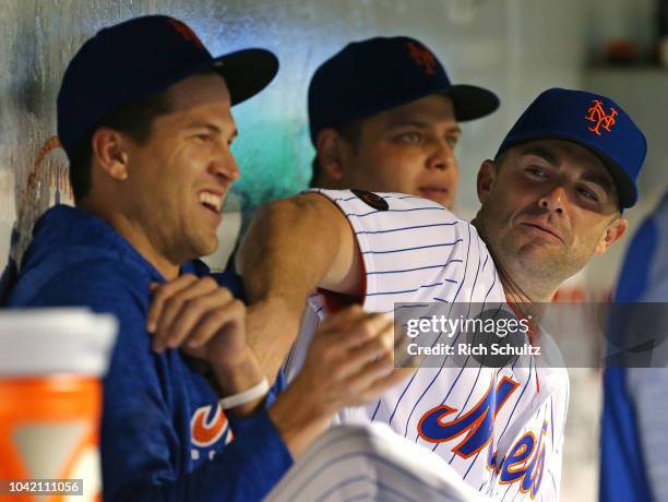 David Wright of the New York Mets clowns around with Jacob deGrom during the eighth inning of a game against the Atlanta Braves at Citi Field on...