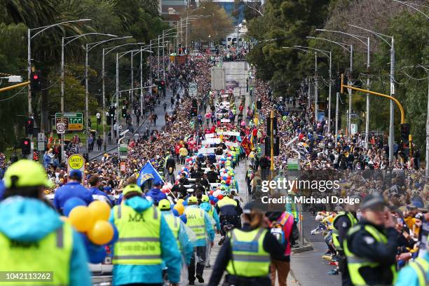 Spectators watch the 2018 AFL Grand Final Parade on September 28, 2018 in Melbourne, Australia.