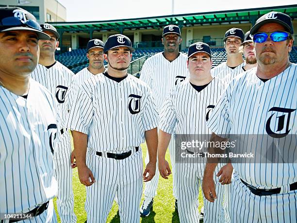 professional baseball players on baseball field - baseball uniform foto e immagini stock