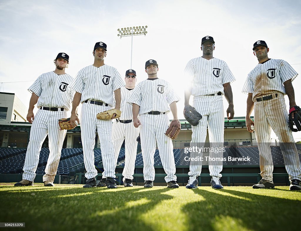 Professional baseball players standing on field