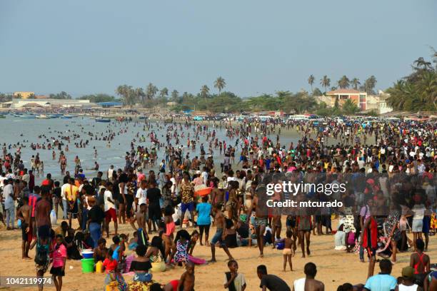 crowds on an african beach, cacuaco, luanda, angola - angola water stock pictures, royalty-free photos & images