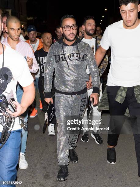 Lacrim is seen during Milan Fashion Week Spring/Summer 2019 on September 21, 2018 in Milan, Italy.