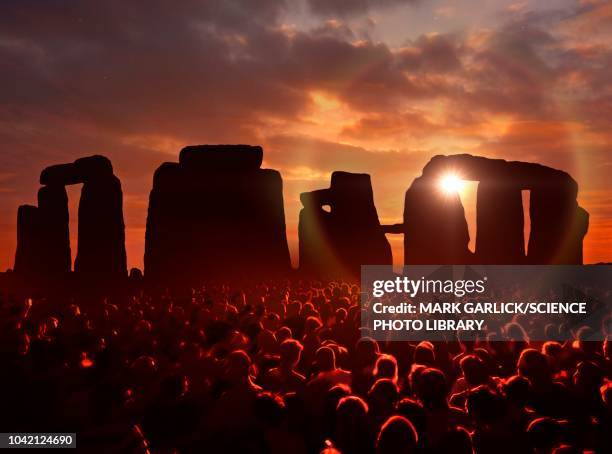 people gathered at stonehenge, illustration - summer solstice stock illustrations