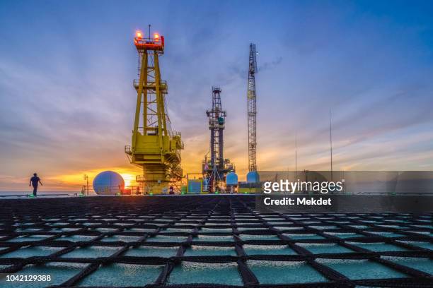 the morning view of oil drilling rig (tender assisted rig type) in gulf of thailand - tank barge stock pictures, royalty-free photos & images