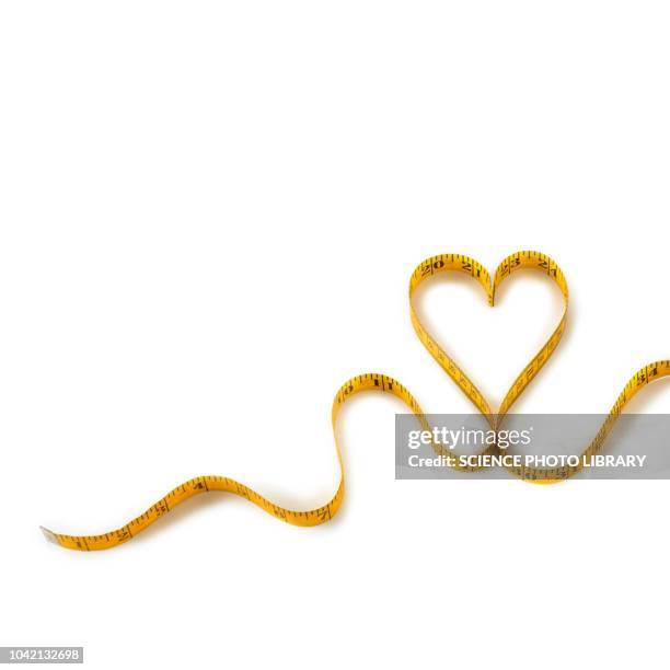 measuring tape in heart shape - tape measure stock pictures, royalty-free photos & images