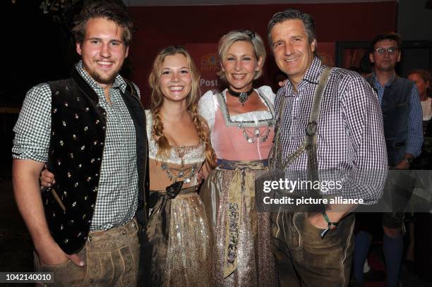 Singer Claudia Jung , her husband Hans Singer , their daughter Anna with her boyfriend Marcus pose at the Wiesn Warm Up Party for Oktoberfest from PR...