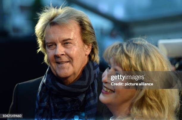 Singer Howard Carpendale and his wife Donnice Pierce walk across the red carpet at the 'Night of the Legends' in Hamburg, Germany, 08 September 2013....