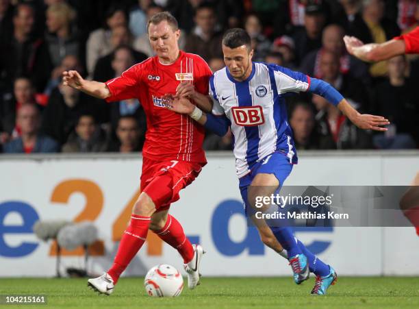 Patrick Kohlmann of Union battles for the ball with Nikita Rukavytsya of Hertha during the Second Bundesliga match between 1.FC Union Berlin and...