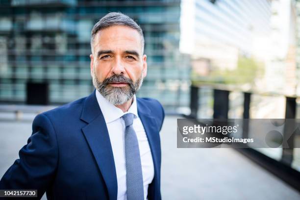 portrait of handsome mature businessman - 50 59 years stock pictures, royalty-free photos & images