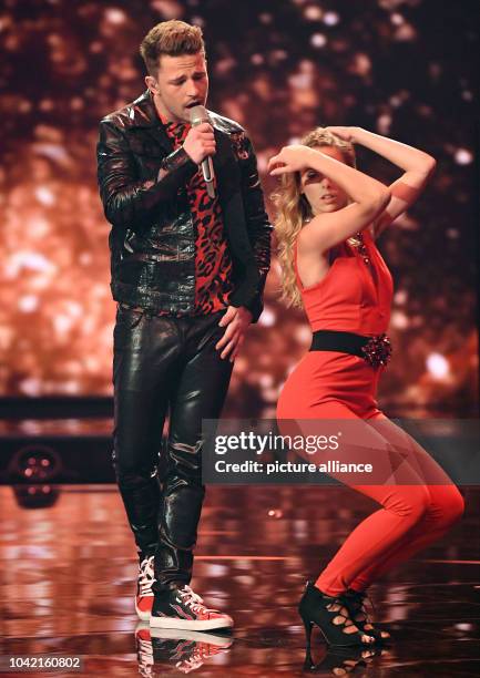 Singer Matthias Bonrath performs on stage during the first live show of the 14th season of the talent show 'Deutschland sucht den Superstar' by...