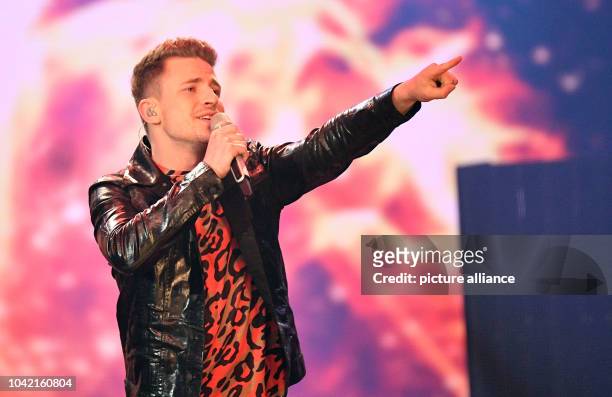 Singer Matthias Bonrath performs on stage during the first live show of the 14th season of the talent show 'Deutschland sucht den Superstar' by...