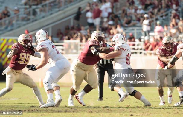 Florida State Seminoles defensive end Brian Burns , Florida State Seminoles defensive lineman Robert Cooper , and Florida State Seminoles defensive...