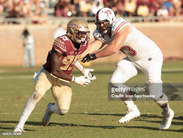 Florida State Seminoles defensive end Brian Burns evades blocker Northern Illinois Huskies offensive tackle Max Scharping during the game between the...