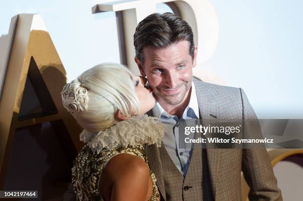 Lady Gaga kisses Bradley Cooper on the cheek at the UK film premiere of 'A Star Is Born' at Vue West End in London. September 27, 2018 in London,...