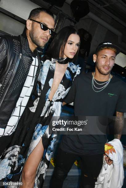 Footballers Daniel Alves , Neymar Jr. , and Bruna Marquezine attend the Off White show as part of Paris Fashion Week Womenswear Spring/Summer 2019 on...