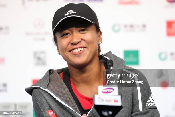 Naomi Osaka of Japan reacts in the attends a press conference ahead of the 2018 China Open at the China National Tennis Centre on September 28, 2018...