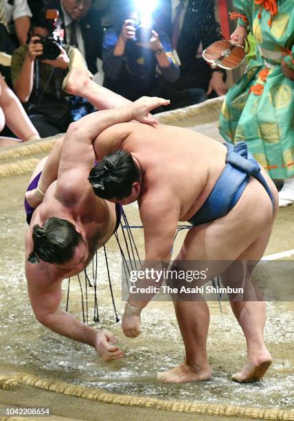 Shodai throws Georgian ozeki Tochinoshin to win on day thirteen of the Grand Sumo Autumn Tournament at Ryogoku Kokugikan on September 21, 2018 in...