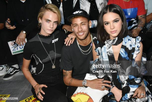 Actress Cara Delevingne, footballer Neymar Jr, Bruna Marquezinee and footballer Daniel Alves attend the Off White show as part of Paris Fashion Week...