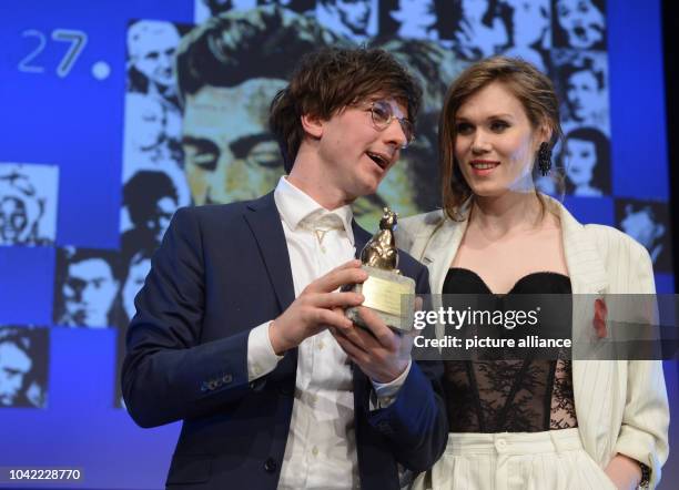 Swedish director Victor Lindgren and actress Jana Bringlov Ekspong pose with the teddy award for the short film "Ta av mig" during the Teddy ceremony...