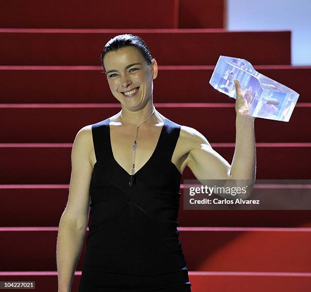 Actress Olivia Williams receives the "Cipresci" award during the 58th San Sebastian International Film Festival Opening Ceremony at the Kursaal...