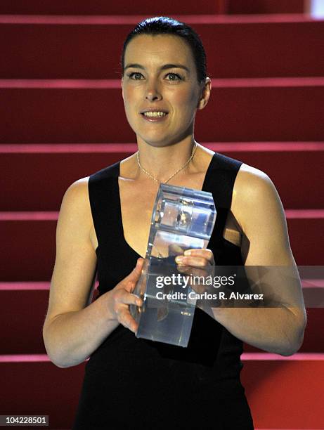 Actress Olivia Williams receives the "Cipresci" award during the 58th San Sebastian International Film Festival Opening Ceremony at the Kursaal...