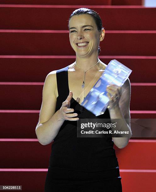 Actress Olivia Williams receives the "Cipresci" award during the 58th San Sebastian International Film Festival Opening Ceremony at the Kursaal...