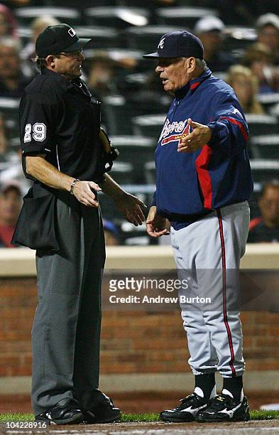 Home plate umpire Bill Hohn argues with Bobby Cox of the Atlanta Braves during a game against the New York Mets on September 17, 2010 at Citi Field...
