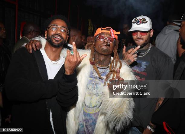 Rappers Big Sean and Lil Wayne and singer Chris Brown attend Lil Wayne's 36th birthday party and Carter V release at HUBBLE on September 28, 2018 in...