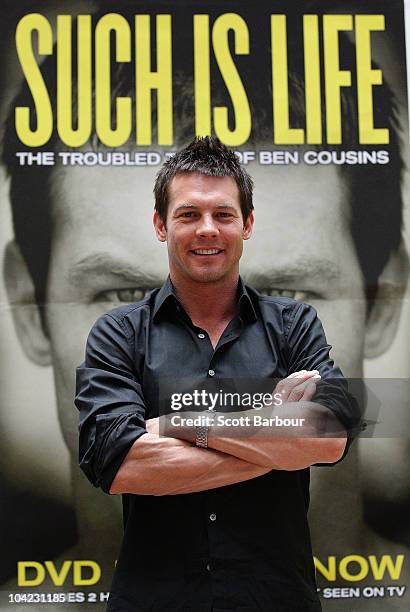 Retired AFL Player Ben Cousins poses in front of a poster promoting his new DVD "Such Is Life - The Troubled Times Of Ben Cousins" at Westfield...