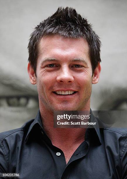 Retired AFL Player Ben Cousins poses in front of a poster of his new DVD "Such Is Life - The Troubled Times Of Ben Cousins" at Westfield Southland on...