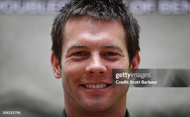 Retired AFL Player Ben Cousins poses in front of a poster of his new DVD "Such Is Life - The Troubled Times Of Ben Cousins" at Westfield Southland on...