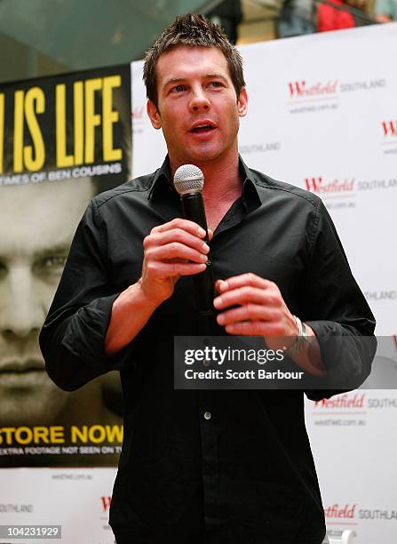 Retired AFL Player Ben Cousins speaks in front of a poster promoting his new DVD "Such Is Life - The Troubled Times Of Ben Cousins" at Westfield...